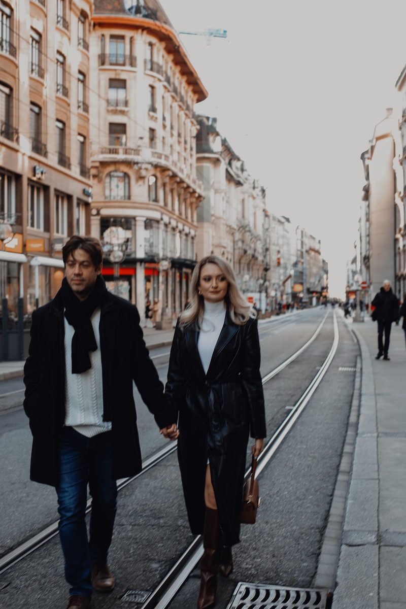 Couple walking hand in hand during a Lausanne portrait session