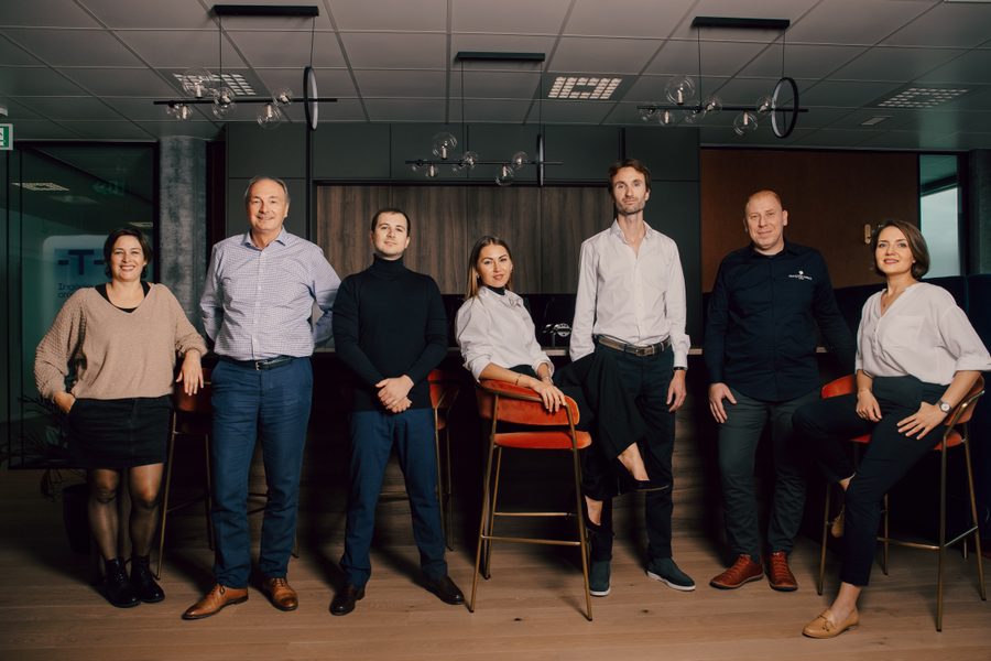 Confident business portrait in a modern Swiss office setting