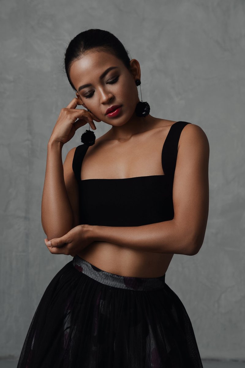 Modern editorial portrait with clean lines and soft colour palette